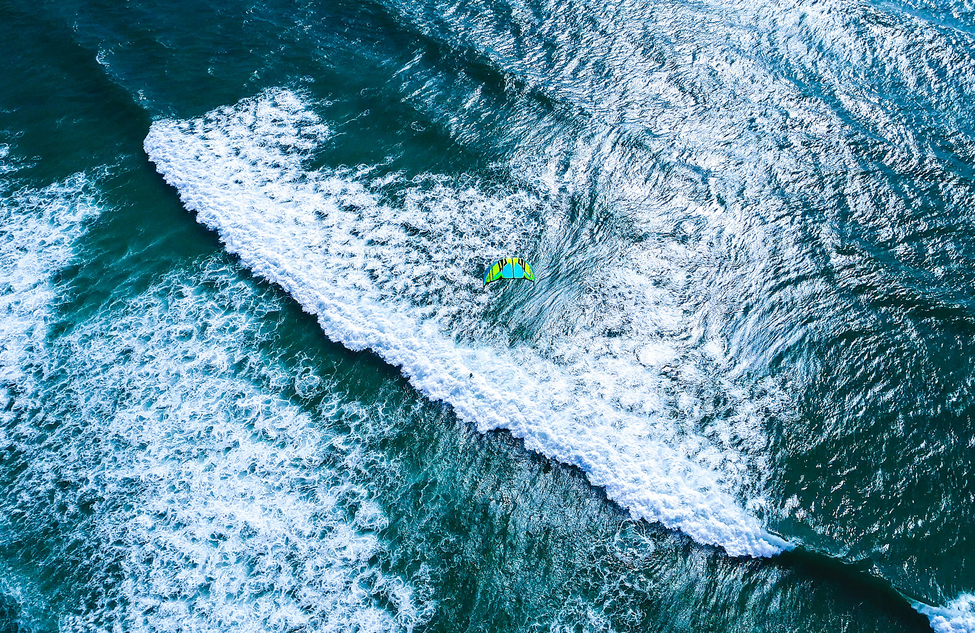 kitesurfing-aerial-blue-water-cover