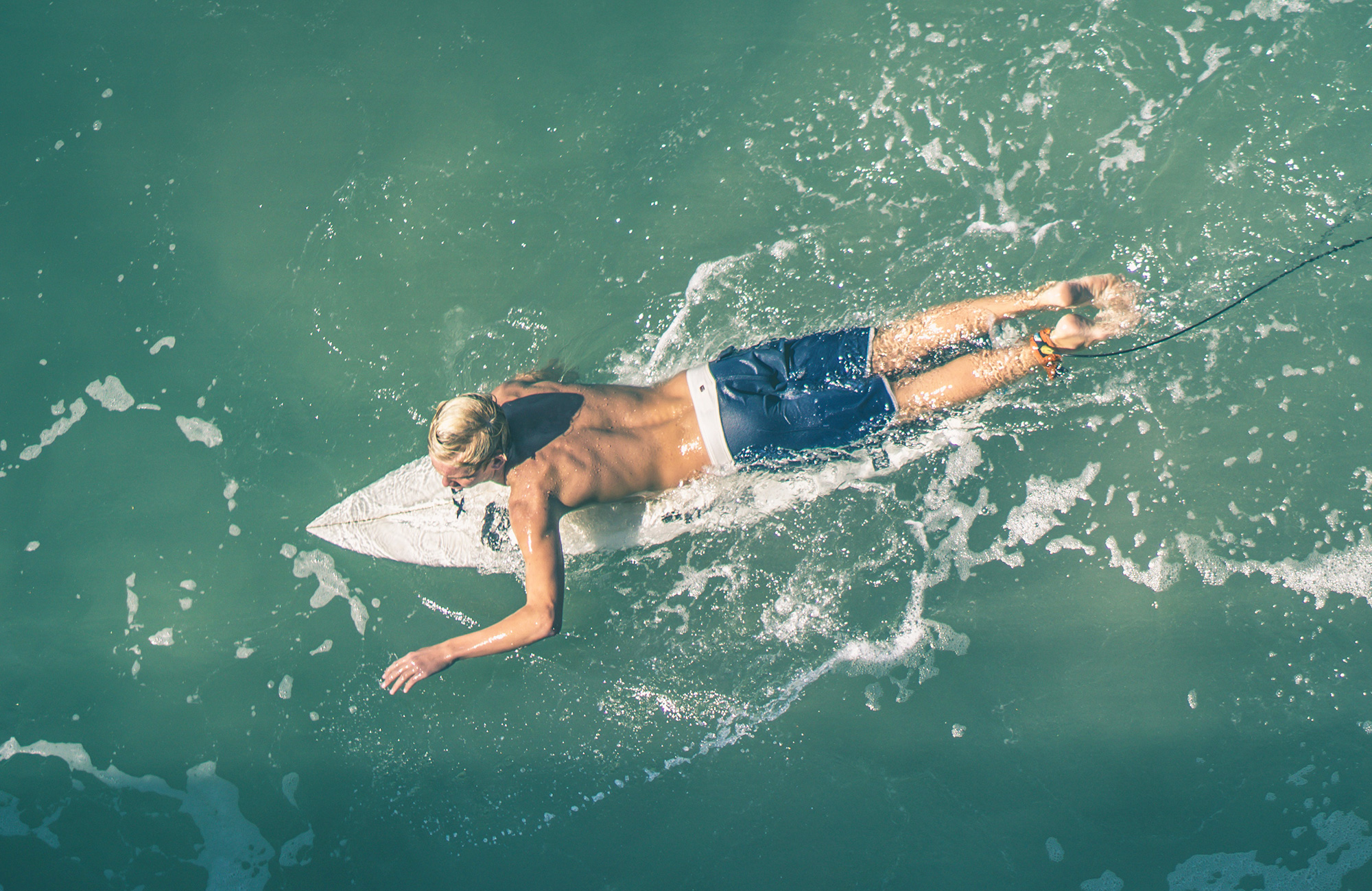 surfing-surfer-paddling-aerial-cover