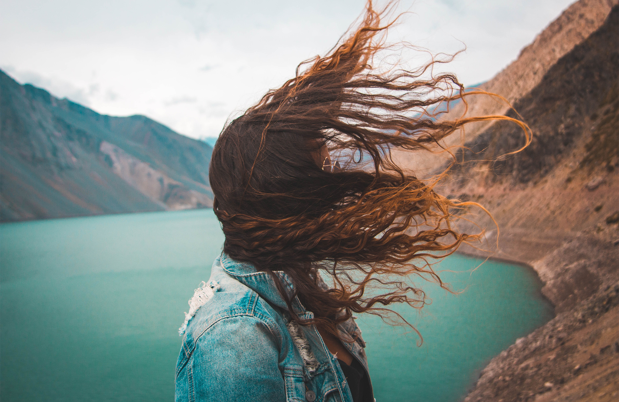 chile-girl-wind-hair-embalse-el-yeso-cover