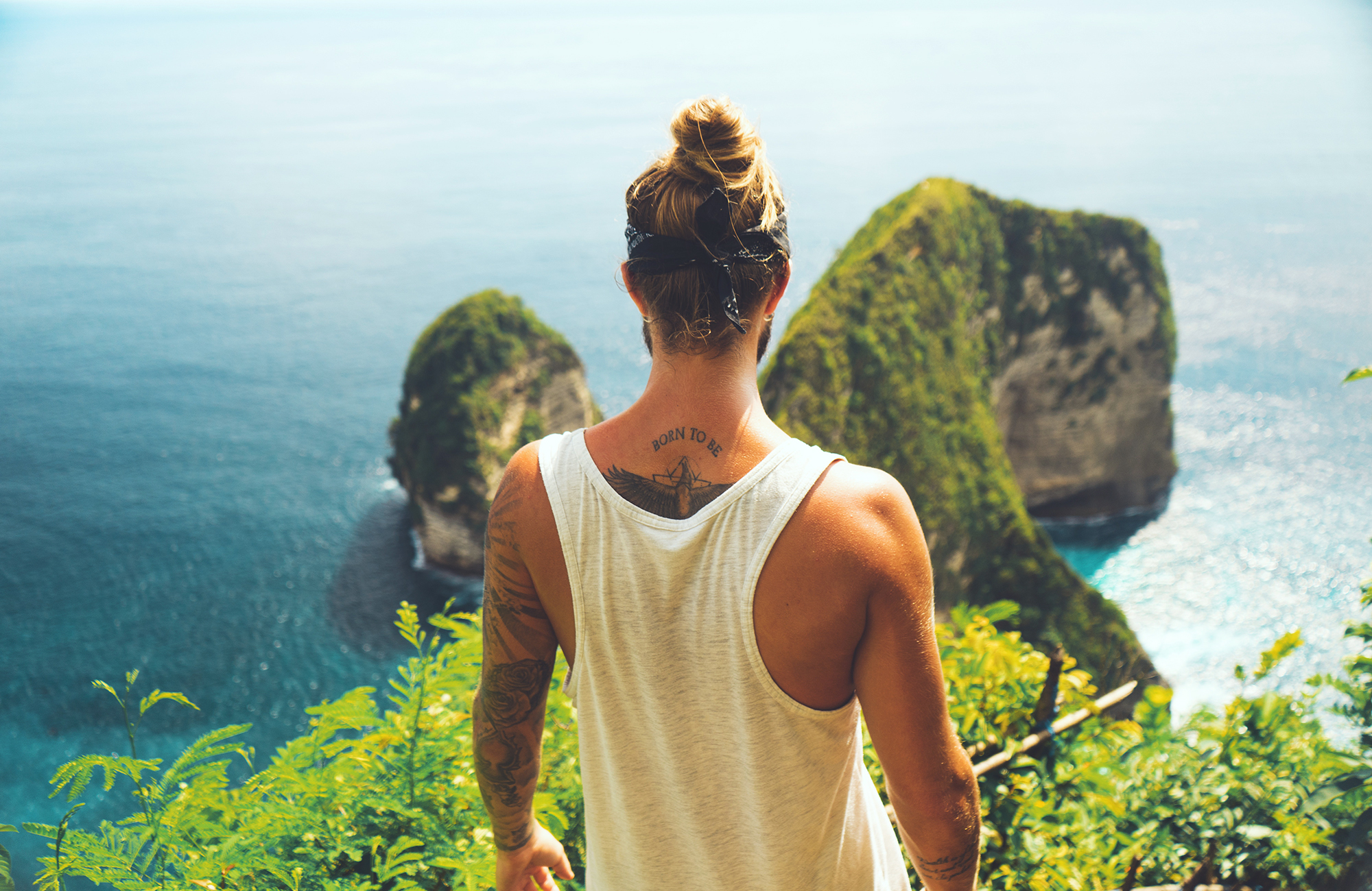 indonesia-man-looking-over-cliff-cover